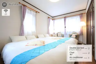 a bedroom with a bed with a blue bed frame at RKT4bedroom ForFamily 30mins Shibuya and Azabu in Tokyo