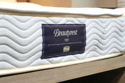 a mattress with a sign on top of it at MONday Apart Ueno Shinokachimachi in Tokyo