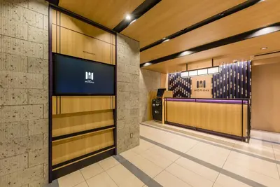 a lobby with a television in a building at MONday Apart Ueno Shinokachimachi in Tokyo