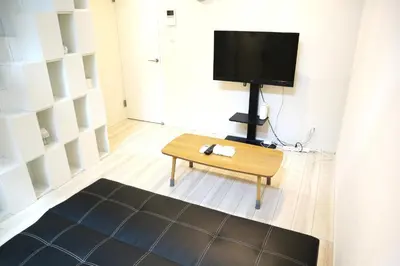 a living room with a tv and a coffee table at Shibuya-ku - Apartment / Vacation STAY 6219 in Tokyo
