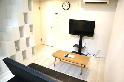 a living room with a tv and a coffee table at Shibuya-ku - Apartment / Vacation STAY 6219 in Tokyo