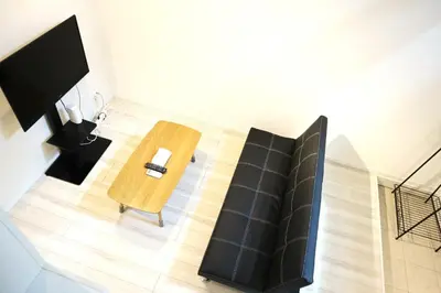 an overhead view of a living room with a wooden table at Shibuya-ku - Apartment / Vacation STAY 6219 in Tokyo