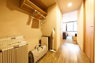 a room with a heater and a living room at MONday Apart Premium HAMAMATSUCHO in Tokyo