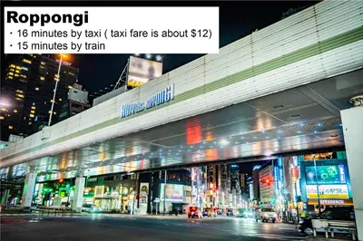 a large building with lights in the city at night at MONday Apart Premium HAMAMATSUCHO in Tokyo