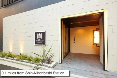 an entrance to a building with a sign on it at MONday Apart Premium Nihonbashi in Tokyo