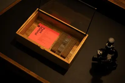 a wooden box with a sign in it on a table at BnA WALL in Tokyo