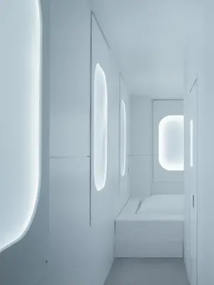 a white bathroom with white walls and mirrors at BnA WALL in Tokyo