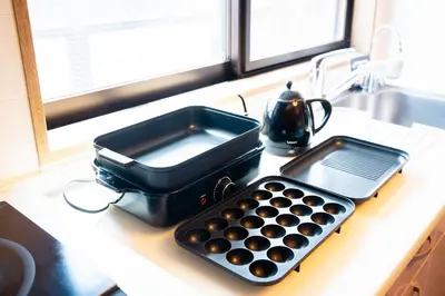 a kitchen counter with a pan and a tray on it at Premier suite Shinjuku okubo Tokyo 3F in Tokyo