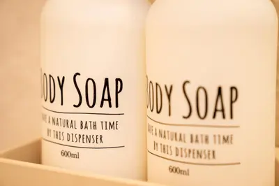 two bottles of oily soap sitting on a shelf at Premier suite Shinjuku okubo Tokyo 3F in Tokyo