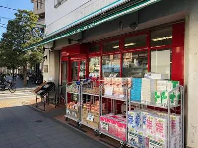 a store front of a grocery store with shelves of food at COTO Tokyo Shibuya 8 in Tokyo