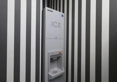 a ice dispenser on the side of a wall at APA Hotel Omori Ekimae in Tokyo