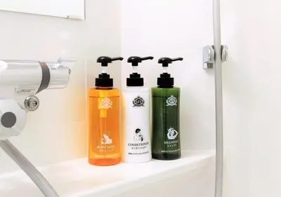 two bottles of soap on a shelf in a bathroom at APA Hotel Omori Ekimae in Tokyo