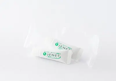 a white container with a green expiration label on it at APA Hotel Omori Ekimae in Tokyo