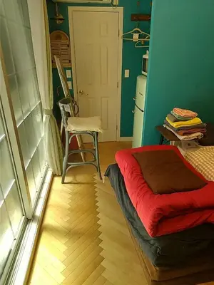 a room with a bed and a table and a chair at \u30db\u30c6\u30eb The Standard Apartment SHIBUYA SASAZUKA B\u30eb\u30fc\u30e0 in Tokyo