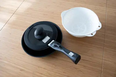a spatula sitting on the floor next to a cup at Laffitte Hirai Condominium Hotel in Tokyo