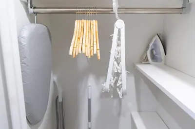 a kitchen with a bunch of utensils on a wall at Laffitte Hirai Condominium Hotel in Tokyo
