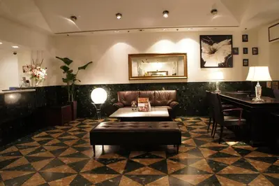 a lobby with a couch and a table and a mirror at Hotel Abest Meguro / Vacation STAY 71400 in Tokyo