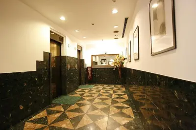 a hallway with a tile floor in a building at Hotel Abest Meguro / Vacation STAY 71400 in Tokyo