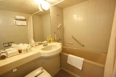 a bathroom with a sink and a toilet and a tub at Hotel Abest Meguro / Vacation STAY 71400 in Tokyo