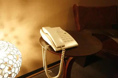 a phone sitting on top of a table at Hotel Abest Meguro / Vacation STAY 71402 in Tokyo