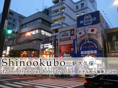a busy city street with buildings and a traffic light at Hotel Abest Meguro / Vacation STAY 71373 in Tokyo