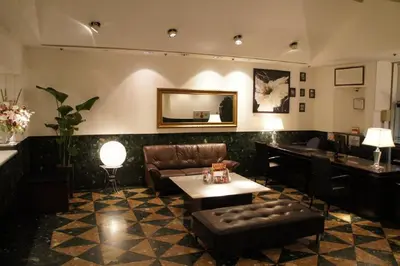 a living room with a couch and a table at Hotel Abest Meguro / Vacation STAY 71406 in Tokyo