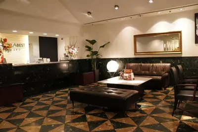 a lobby with a couch and a table and a bar at Hotel Abest Meguro / Vacation STAY 71406 in Tokyo