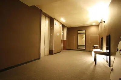 an empty hallway with a chair in a building at Hotel Abest Meguro / Vacation STAY 71406 in Tokyo