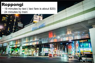 a large building with lights in the city at night at MONday Apart Nihonbashi Ningyocho in Tokyo