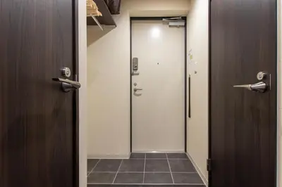 a bathroom with a door and a walk in shower at VACATION INN HEIWAJIMA I in Tokyo