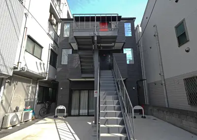 a building with a spiral staircase in front of it at \u30b9\u30dd\u30eb\u30c8\u6771\u4eac in Tokyo