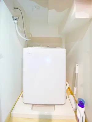 a white refrigerator in a kitchen with its door open at nestay villa tokyo otsuka in Tokyo