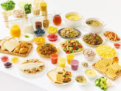 a table filled with different types of food at Comfort Hotel Tokyo Higashi Nihombashi in Tokyo