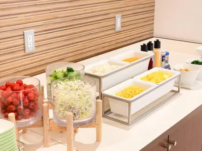 a kitchen counter with three containers of food on it at Comfort Hotel Tokyo Kiyosumi Shirakawa in Tokyo