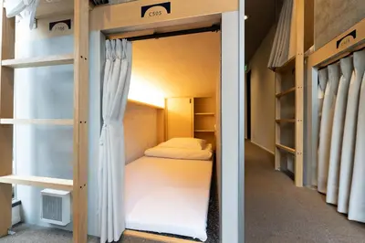a small room with bunk beds in it at unito CHIYODA in Tokyo
