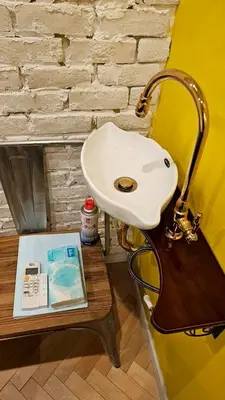 a white sink sitting on top of a wooden table at \u30db\u30c6\u30eb The Standard Apartment Shibuya D 2020\u5e74\u30aa\u30fc\u30d7\u30f3 in Tokyo