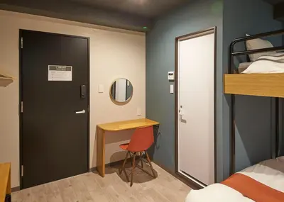 a room with a desk and a bunk bed at IKIDANE Residential Hotel Sumida Kyojima in Tokyo