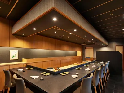 a large conference room with a long table and chairs at Grand Nikko Tokyo Bay Maihama in Urayasu