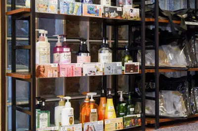 a shelf filled with lots of bottles of alcohol at Otsuka Town Hotel in Tokyo