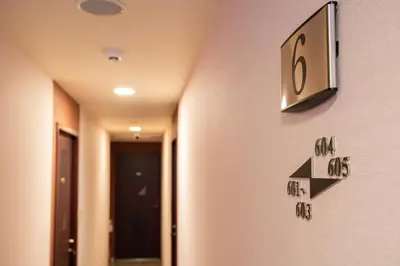 a clock on the wall of a hospital room at Otsuka Town Hotel in Tokyo