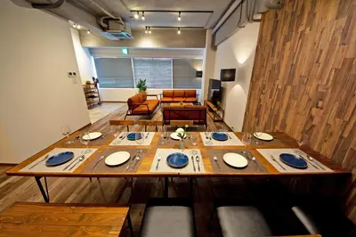 a large wooden table in a living room at American Vintage Suite in Tokyo
