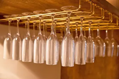a bunch of glass bottles hanging from a rack at American Vintage Suite in Tokyo