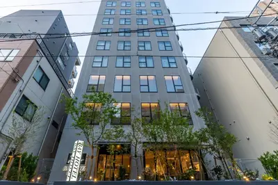 a tall building in the middle of a city at Bay Hotel Tokyo Hamamatsucho in Tokyo