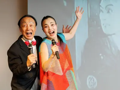 a man and a woman singing into microphones at Asakusa View Hotel Annex Rokku in Tokyo
