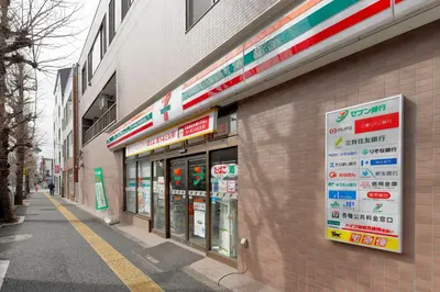 a store with signs on the side of a building at Terrace Terano#101 in Tokyo