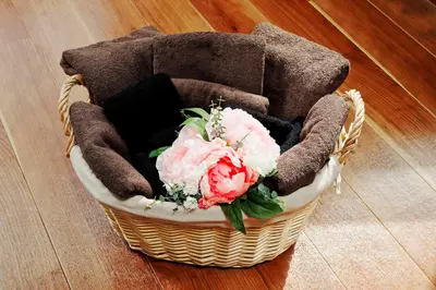a basket with flowers in it on the floor at Terrace Terano#101 in Tokyo