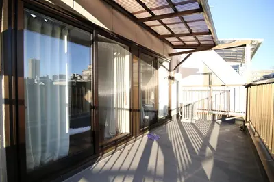 a balcony with a view of the city at MUMU HOUSE in Tokyo
