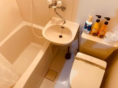 a bathroom with a sink and a toilet and a bath tub at Tokyo Stay Nakano in Tokyo