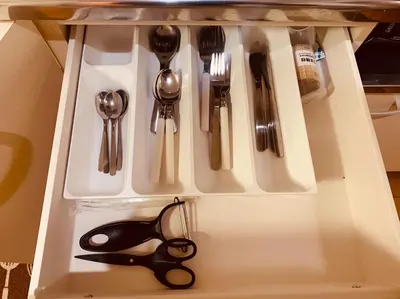 a drawer with scissors and other kitchen utensils at Tokyo Stay Nakano in Tokyo