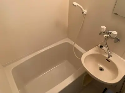 a bathroom with a sink and a toilet and a tub at Tokyo Stay Nakano in Tokyo